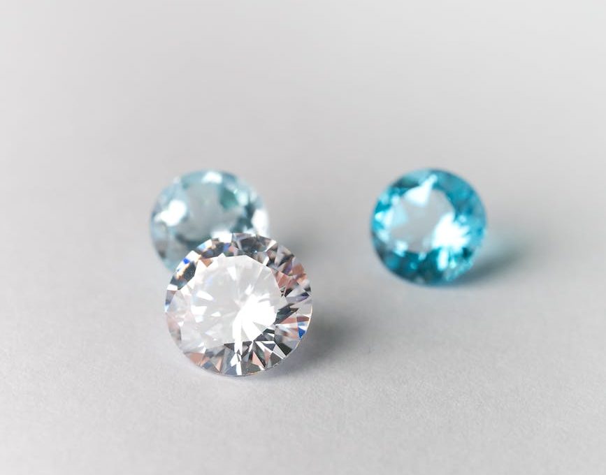 close up shot of diamonds on white surface